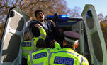 A man is detained by the police as he attempts to talk on Speakers' Corner in Hyde Park amid the coronavirus disease (COVID-19) outbreak in London, Britain November 15, 2020. REUTERS/Simon Dawson