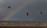 Kite surfers are pictured in front of the Burbo Bank offshore wind farm near New Brighton, Britain, October 6, 2020. REUTERS/Phil Noble TPX IMAGES OF THE DAY