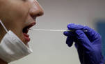 A firefighter from the Marins-Pompiers of Marseille (Marseille Naval Fire Battalion) takes a saliva sample from a collegue who is being tested for the coronavirus disease (COVID-19) at their fire station in Marseille, France, September 22, 2020. REUTERS/Eric Gaillard