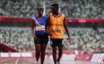 Tokyo 2020 Paralympic Games - Athletics - Women's 200m - T11 Round 1 - Heat 4 - Olympic Stadium, Tokyo, Japan - September 2, 2021. Keula Nidreia Pereira Semedo of Cape Verde and guide Manuel Antonio Vaz da Veiga walk together after he proposed to her after competing REUTERS/Athit Perawongmetha