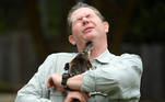 Taronga Zoo senior keeper Rob Dockerill holds Annie the Platypus during a World Wildlife Day announcement pledging to save the Australian platypus from extinction, at Taronga Zoo in Sydney, Australia, March 3, 2021. AAP Image/Dean Lewins/via REUTERS ATTENTION EDITORS - THIS IMAGE WAS PROVIDED BY A THIRD PARTY. NO RESALES. NO ARCHIVE. AUSTRALIA OUT. NEW ZEALAND OUT. TPX IMAGES OF THE DAY