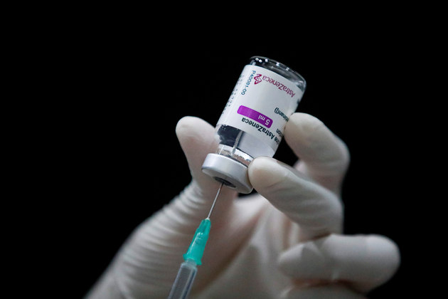 A health worker prepares a dose of AstraZeneca COVID-19 vaccine against the coronavirus disease (COVID-19) as Thailand start a mass inoculation at a gymnasium inside the Siam paragon Shopping center, Bangkok, Thailand June 7, 2021. REUTERS/Soe Zeya Tun