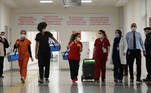 Health workers carry Sinovac's CoronaVac COVID-19 vaccine boxes at Sancaktepe Sehit Dr. Ilhan Varank Training and Research Hospital, in Istanbul, Turkey January 14, 2021. REUTERS/Murad Sezer