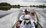 Municipal health workers travel on a boat along the Solimoes river banks, where Ribeirinhos (river dwellers) live, to apply the AstraZeneca/Oxford vaccine for the coronavirus disease (COVID-19) to the residents, in Manacapuru, Amazonas state, Brazil, February 1, 2021. Picture taken February 1, 2021. REUTERS/Bruno Kelly