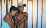 Francisca do Carmo and her husband Raimundo do Carmo, react after receiving the AstraZeneca/Oxford vaccine for the coronavirus disease (COVID-19), along the Solimoes river banks, where Ribeirinhos (river dwellers) live, in Manacapuru, Amazonas state, Brazil, February 1, 2021. Picture taken February 1, 2021. REUTERS/Bruno Kelly