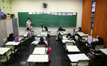 Students attend a class on the first day of schools regaining full capacity since the beginning of the coronavirus disease (COVID-19) pandemic, in Sao Paulo, Brazil October 18, 2021. REUTERS/Carla Carniel