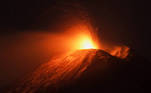 An eruption from Mount Etna lights up the sky during the night, seen from the small village of Fornazzo under the volcano, Italy, January 13, 2021. Picture taken January 13, 2021. REUTERS/Antonio Parrinello