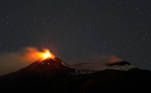 Large streams of red hot lava shoot into the night sky as Mount Etna, Europe's most active volcano, leaps into action, seen from the village of Fornazzo, Italy, February 3, 2021. Picture taken February 3, 2021. REUTERS/Antonio Parrinello