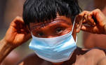  
A man from the indigenous Yanomami ethnic group holds his protective face mask, amid the spread of the coronavirus disease (COVID-19), at the 4th Surucucu Special Frontier Platoon of the Brazilian army in the municipality of Alto Alegre, state of Roraima, Brazil July 1, 2020. REUTERS/Adriano Machado
