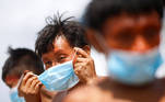 A man from the indigenous Yanomami ethnic group holds his protective face mask, amid the spread of the coronavirus disease (COVID-19), at the 4th Surucucu Special Frontier Platoon of the Brazilian army in the municipality of Alto Alegre, state of Roraima, Brazil July 1, 2020. REUTERS/Adriano Machado