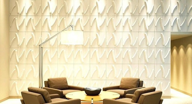 Sala de estar com parede revestida com placa de gesso 3D
