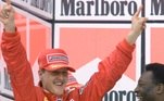 F1-BRAZIL-SCHUMACHER-PELE:SAP15-20000326-SAO PAULO, BRAZIL: Soccer legend Pele (R) congratulates former German Formula One world champion Michael Schumacher (L) of Ferrari on the podium after Schumacher won the Brazilian Formula One Grand Prix in Sao Paulo, Brazil on Sunday 26 March 2000. (ELECTRONIC IMAGE) EPA PHOTO DPA/STR/kn-fob