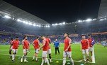 Jogadores suíços no gramado do estádio 974