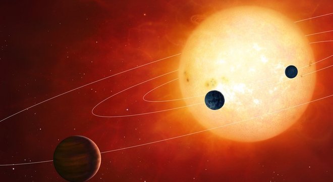 Os planetas se formam ao redor das estrelas quando a gravidade começa a coletar grãos de poeira e os une em pequenas bolas