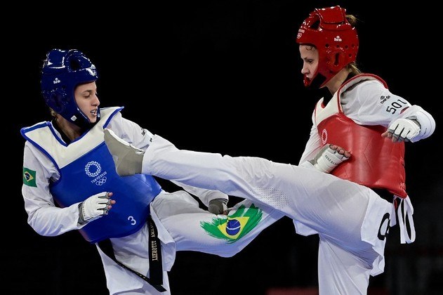 Brazil's Milena Titoneli (Blue) and Croatia's Matea Jelic (Red) compete in the taekwondo women's -67kg quarter-final bout during the Tokyo 2020 Olympic Games at the Makuhari Messe Hall in Tokyo on July 26, 2021.
