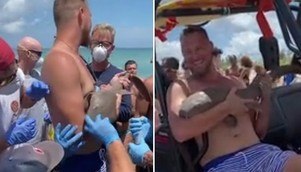 Rapaz sorridente com tubarão cravado no braço choca multidão no litoral da Flórida (Montagem/R7)