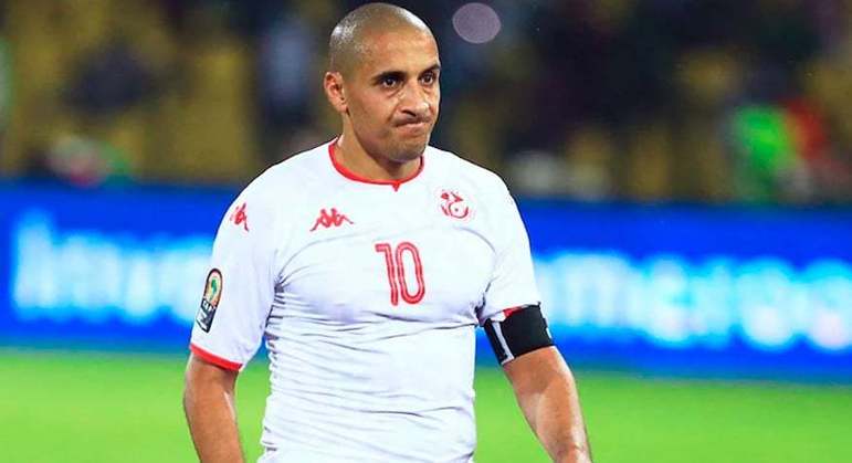 Tunísia: Wahbi Khazri - Atualmente no Montpellier, o atacante tem 31 anos e é um dos principais nomes da seleção tunisiana na qual estreou em 2013. Seus números na equipe nacional são consideravelmente bons. Em 71 jogos, ele fez 24 jogos com a camisa de seu país.